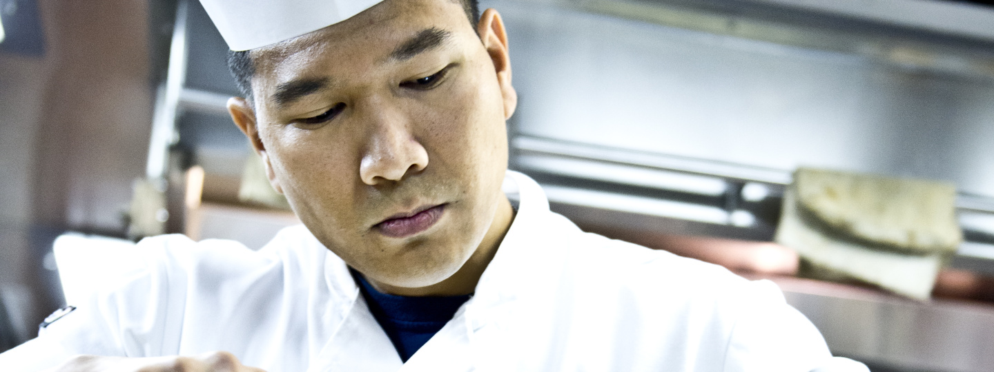 Culinary Specialist preparing meals.