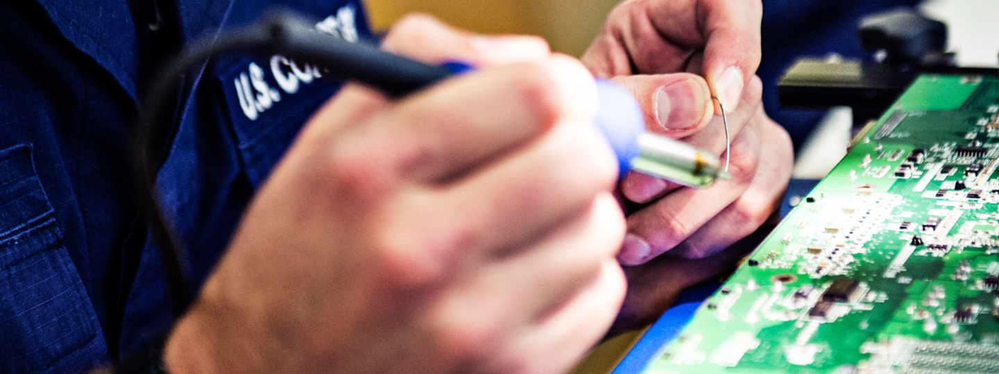 Electronics Technician soldering a circuit board
