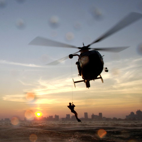 Helicopter hovering over the sea